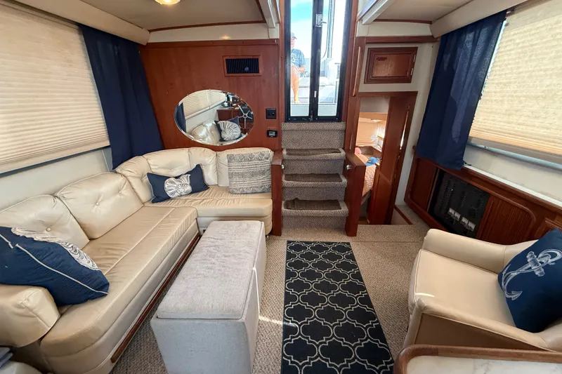 Slide: The Image of Luxurious interior of 1989 Carver 3807 Aft Cabin Motor Yacht with plush seating and nautical decor. - 37