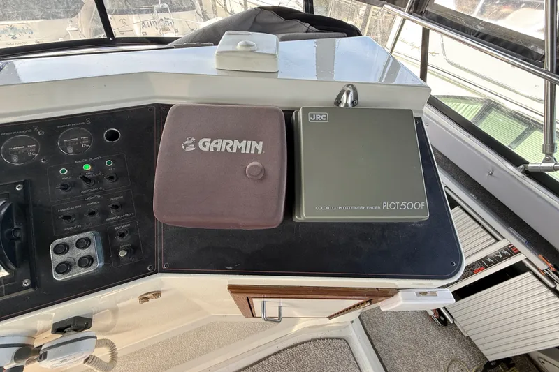 Slide: The Image of Control panel of a 1989 Carver 3807 Aft Cabin Motor Yacht with Garmin and JRC devices. - 22