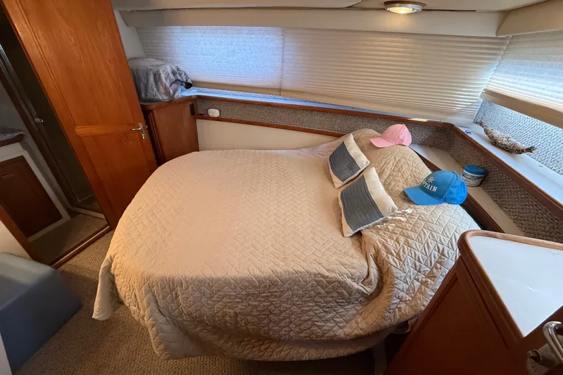 Slide: The Image of Cozy bedroom in 1989 Carver 3807 Aft Cabin Motor Yacht with double bed and nautical decor. - 62