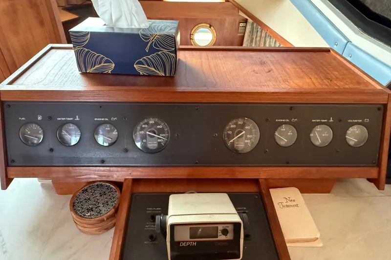 Slide: The Image of 1989 Carver 3807 Aft Cabin Motor Yacht dashboard with gauges and wooden finish. - 39