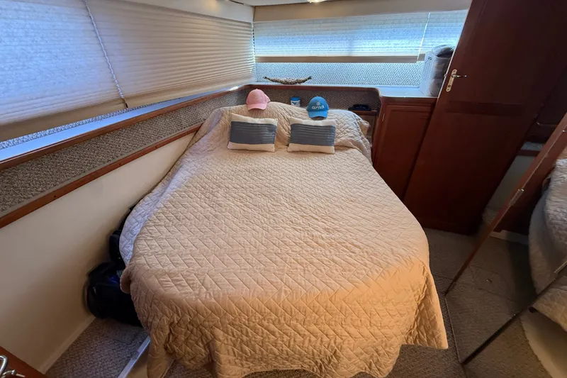 Slide: The Image of Cozy bedroom in 1989 Carver 3807 Aft Cabin Motor Yacht with quilted bedding. - 63