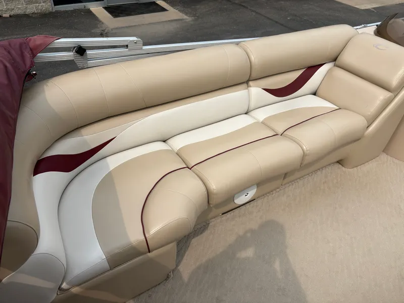 Slide: The Image of The image shows a beige and white bench seat with red accents on a boat. - 9
