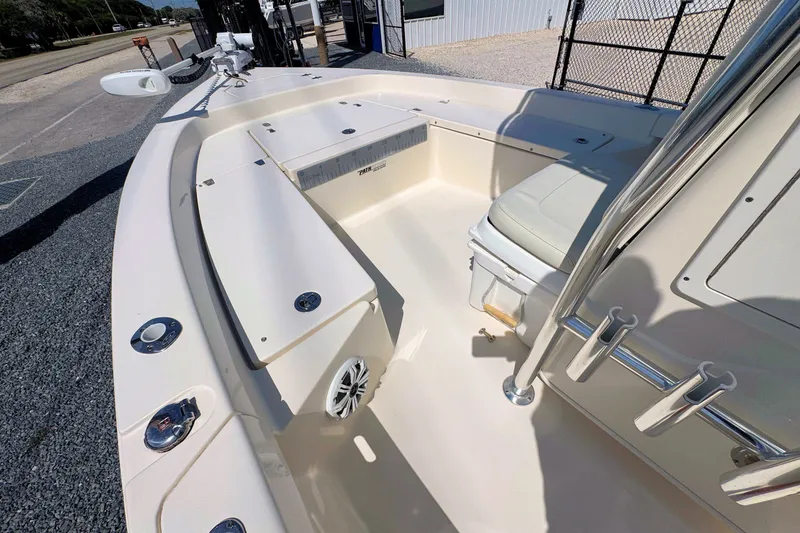 Slide: The Image of 2015 Pathfinder 2200 Tournament Edition boat interior with seating and storage compartments. - 16