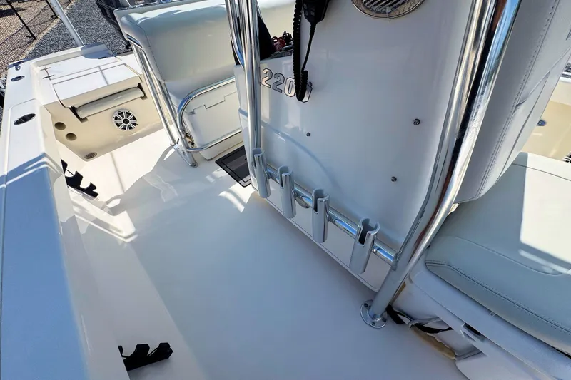 Slide: The Image of 2015 Pathfinder 2200 Tournament Edition boat interior with rod holders and seating. - 13