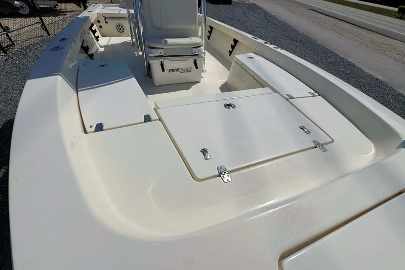 Slide: The Image of 2015 Pathfinder 2200 Tournament Edition boat interior with storage compartments and seating. - 18