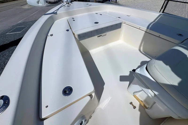 Slide: The Image of 2015 Pathfinder 2200 Tournament Edition boat interior with seating and storage compartments. - 17