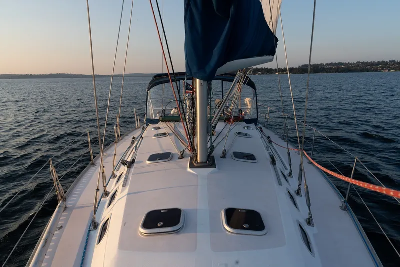 Slide: The Image of Sailing on a 2000 Catalina 400 MkII yacht during a serene sunset on open water. - 41