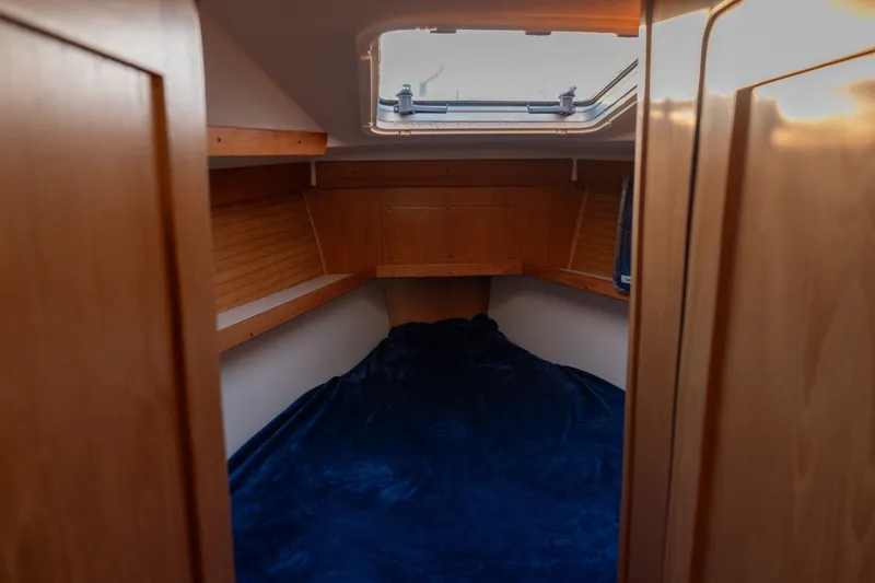 Slide: The Image of Cozy cabin interior of 2000 Catalina 400 MkII sailboat with wooden finish and skylight. - 36