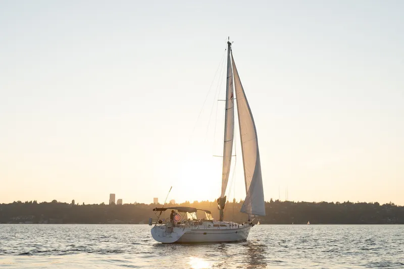 Slide: The Image of Sailboat Catalina 400 MkII 2000 on serene water at sunset. - 45