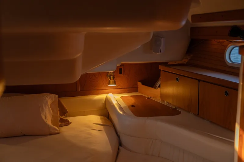 Slide: The Image of Cozy cabin interior of 2000 Catalina 400 MkII sailboat with warm lighting. - 33