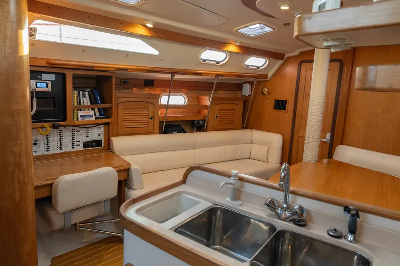 Slide: The Image of Interior of 2000 Catalina 400 MkII yacht with cozy seating and modern amenities. - 20