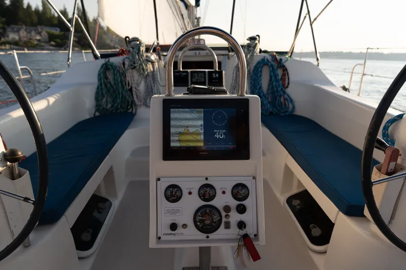 Slide: The Image of Cockpit of 2000 Catalina 400 MkII sailboat with navigation instruments and blue seating. - 9