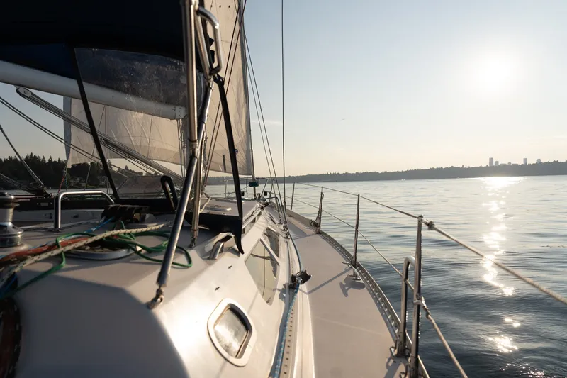 Slide: The Image of Sailing on a 2000 Catalina 400 MkII yacht at sunset, calm waters, scenic view. - 4
