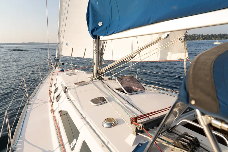 Slide: The Image of Sailing on a 2000 Catalina 400 MkII yacht with blue sails on open water. - 12