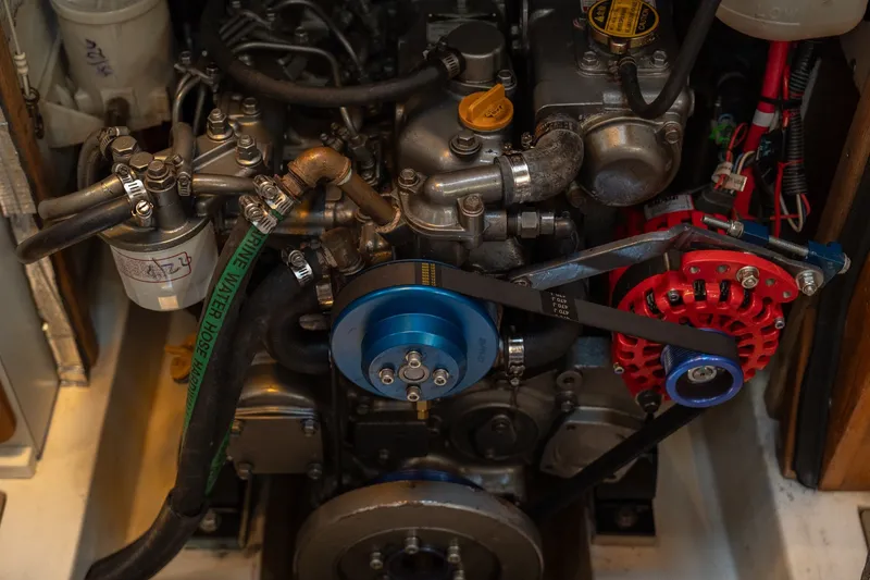 Slide: The Image of Engine compartment of a 2000 Catalina 400 MkII sailboat, showcasing mechanical components. - 39