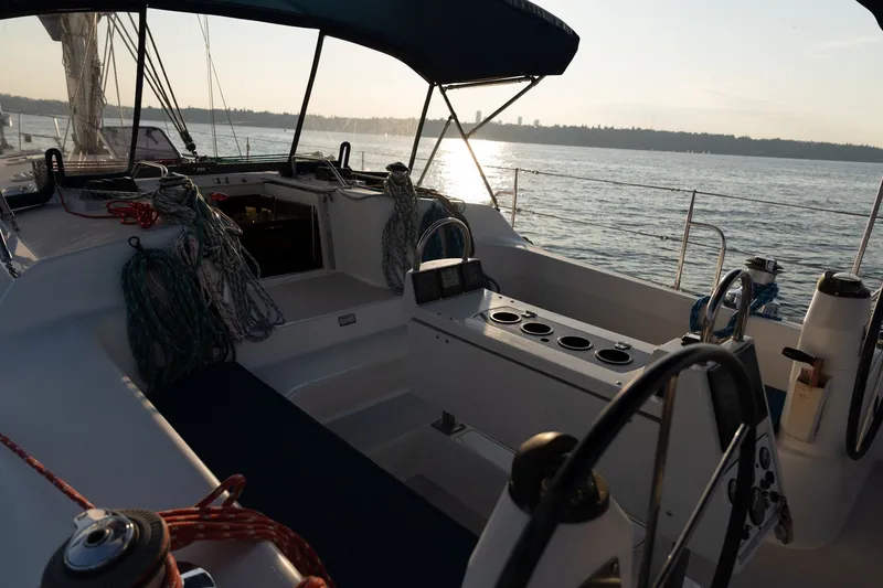 Slide: The Image of Cockpit of 2000 Catalina 400 MkII sailboat at sunset on the water. - 8