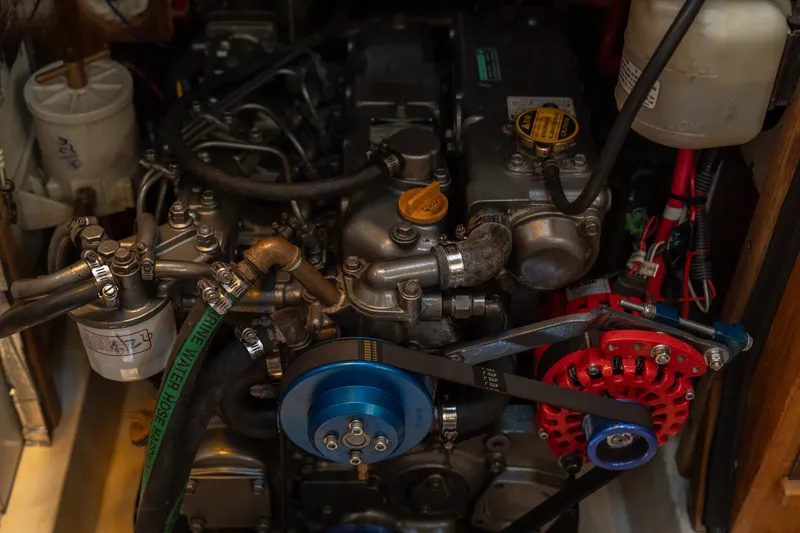 Slide: The Image of Engine compartment of a 2000 Catalina 400 MkII sailboat, showcasing mechanical components. - 38
