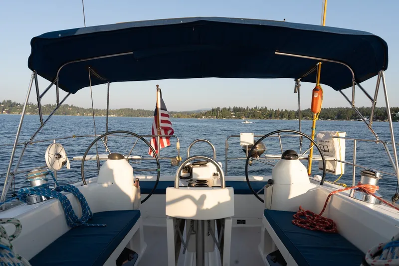 Slide: The Image of Cockpit view of 2000 Catalina 400 MkII sailboat on a serene lake. - 14