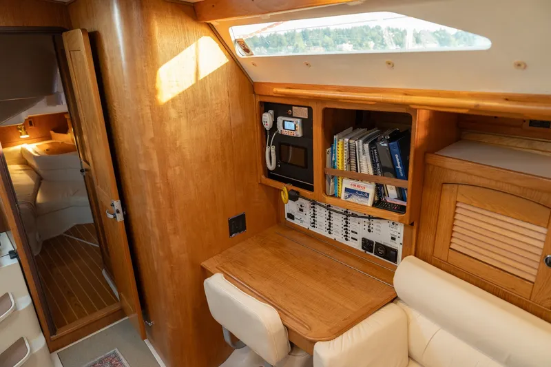 Slide: The Image of Interior of 2000 Catalina 400 MkII sailboat with navigation station and cozy cabin. - 28