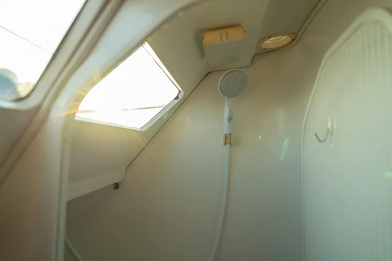 Slide: The Image of Interior shower of a 2000 Catalina 400 MkII sailboat, featuring a handheld showerhead. - 35