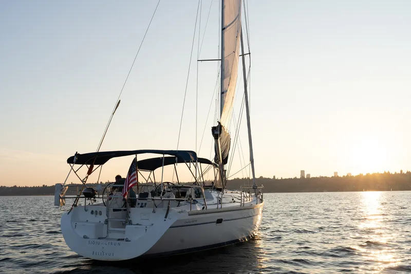 Slide: The Image of Sailing yacht Catalina 400 MkII, 2000 model, on serene water at sunset. - 44