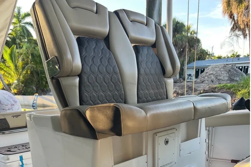 Slide: The Image of Luxury seating on 2021 Tidewater 272 CC Adventure boat, featuring premium upholstery. - 6
