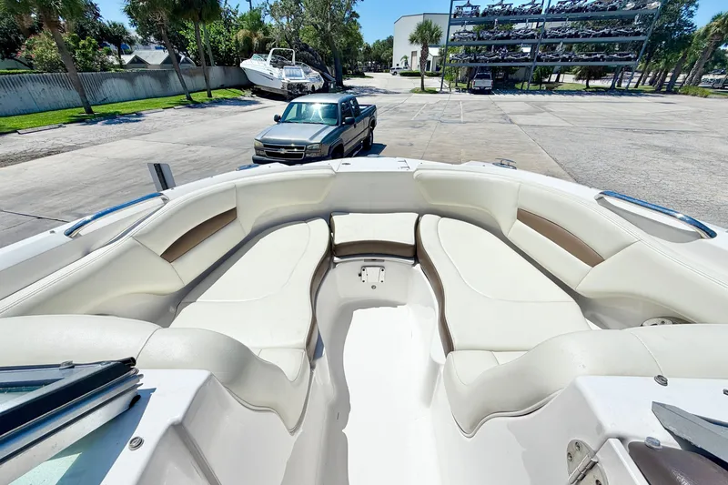 Slide: The Image of 2015 Chaparral 224 Sunesta boat interior with spacious seating and sleek design. - 20