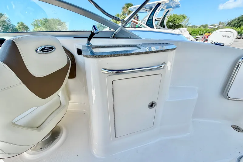 Slide: The Image of Interior of 2015 Chaparral 224 Sunesta boat with seating and sink area. - 15