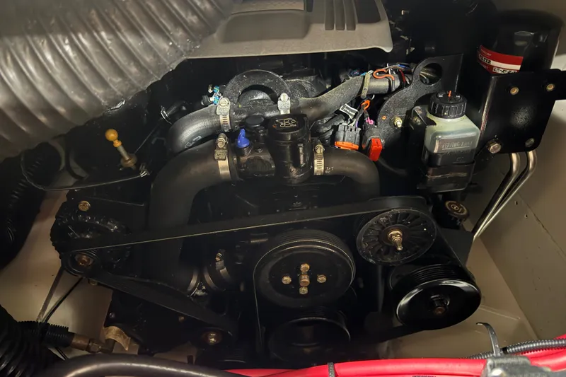 Slide: The Image of Engine compartment of a 2015 Sea Ray SDX 270 boat, showcasing mechanical components. - 17