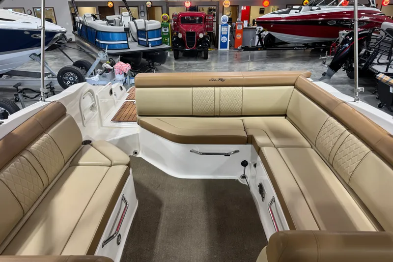 Slide: The Image of Interior of a 2015 Sea Ray SDX 270 boat with tan leather seating. - 14