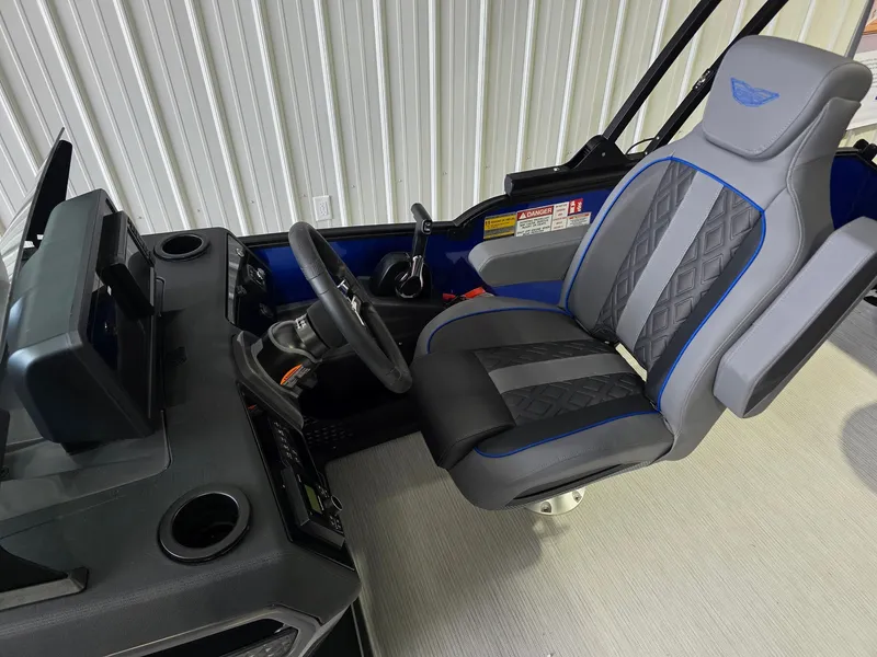 Slide: The Image of The interior of a 2027 Bennington 21ML SPS TRI features a modern captain's chair and helm console. - 10