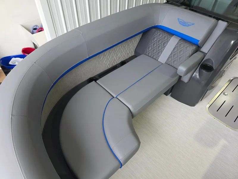 Slide: The Image of The image shows a luxurious gray seating area with blue accents on a boat. - 8