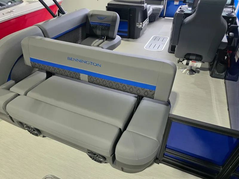 Slide: The Image of The image shows the interior of a 2027 Bennington 21ML SPS TRI with gray and blue seating. - 14