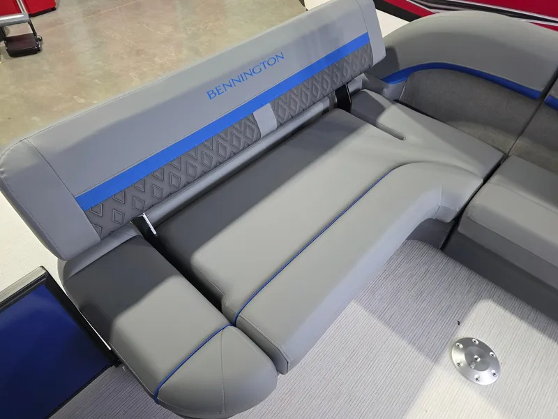 Slide: The Image of Gray upholstery with blue accents on a Bennington boat seat, modern and stylish design. - 13