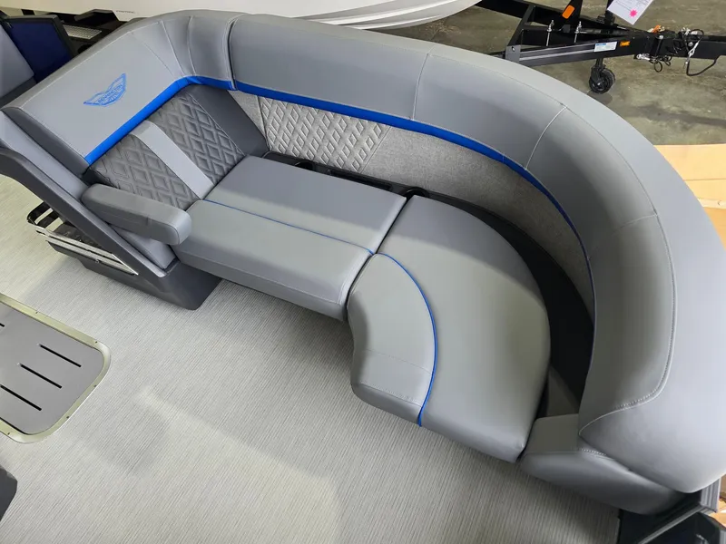 Slide: The Image of Gray upholstered seating with blue accents on a boat. - 9