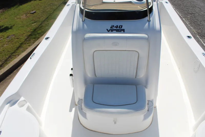 Slide: The Image of The image shows the cockpit of a 2014 Sea Fox 240 Viper with a white seat and helm console. - 14