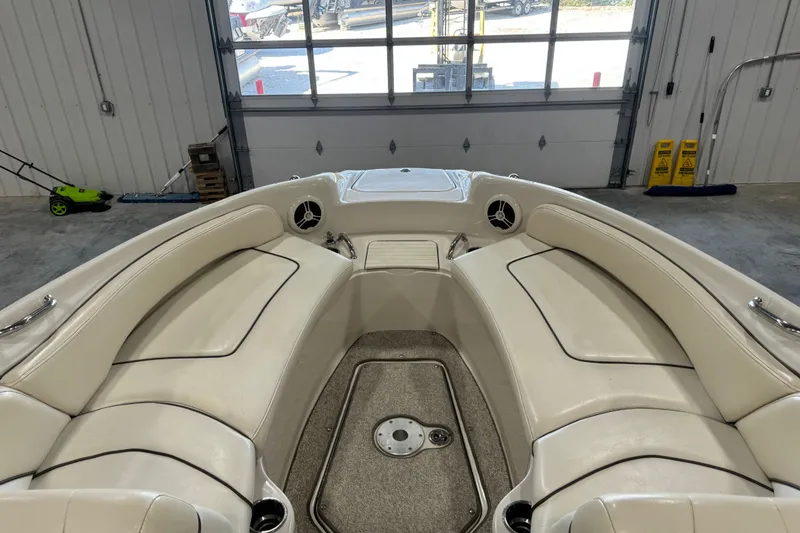 Slide: The Image of Interior view of a 2008 Sea Ray 240 Sundeck boat with beige seating. - 8