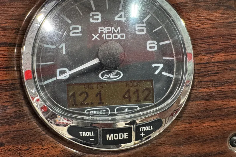 Slide: The Image of Tachometer of 2008 Sea Ray 240 Sundeck showing 12.1 volts and 412 hours. - 13