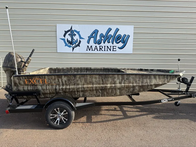 The Image of An Excel Boats 1554 Eclipse 40HP from 2027 on a trailer in front of a building with an 'Ashley Marine' sign. - 1