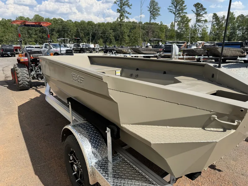 Slide: The Image of An Edge Duck Boat Sportsman Series 553 from 2027 sits on a trailer. It features a simple, sturdy design. - 3