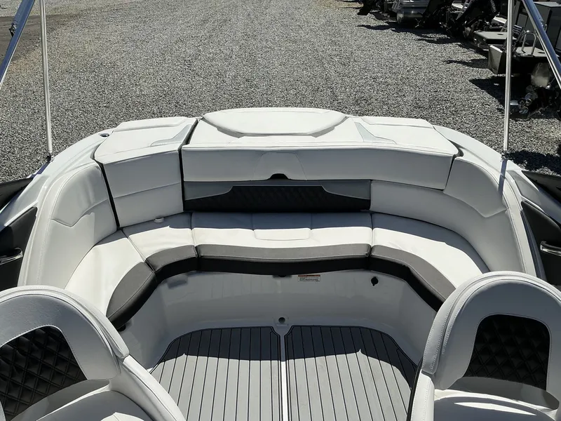 Slide: The Image of The image shows the interior of a Monterey 224FS boat with white and black seating. - 11