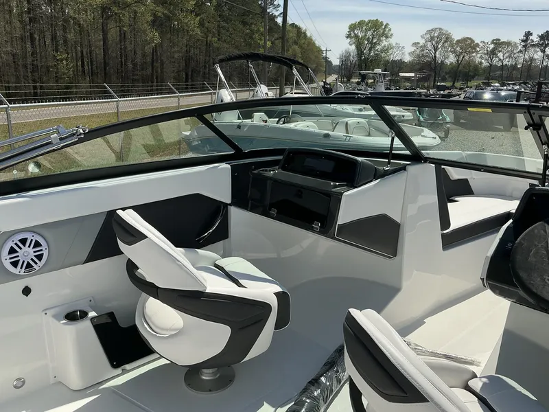 Slide: The Image of The image shows the cockpit of a 2025 Monterey M-22 boat with modern seating and controls. - 11