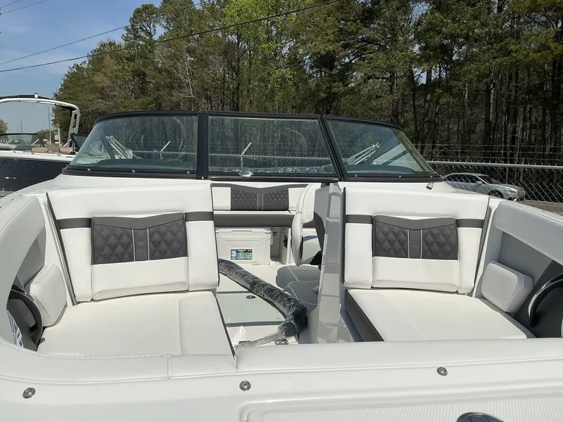 Slide: The Image of The image shows the interior of a 2025 Monterey M-22 boat with white and gray seating. - 8