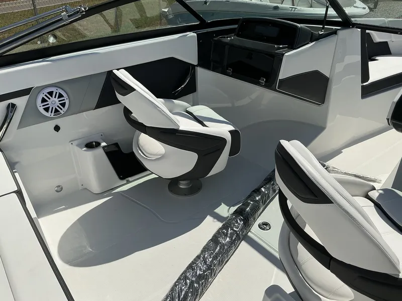 Slide: The Image of The image shows the cockpit of a 2025 Monterey M-22 boat with modern seating and controls. - 12