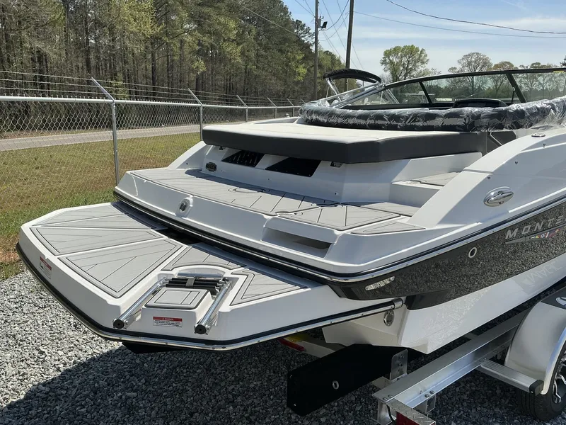 Slide: The Image of The image shows a modern 2025 Monterey M-22 boat with a sleek design. - 7
