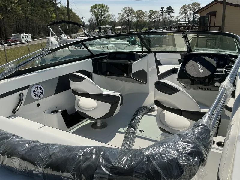 Slide: The Image of The image shows the cockpit of a 2025 Monterey M-22 boat with modern seating and controls. - 6
