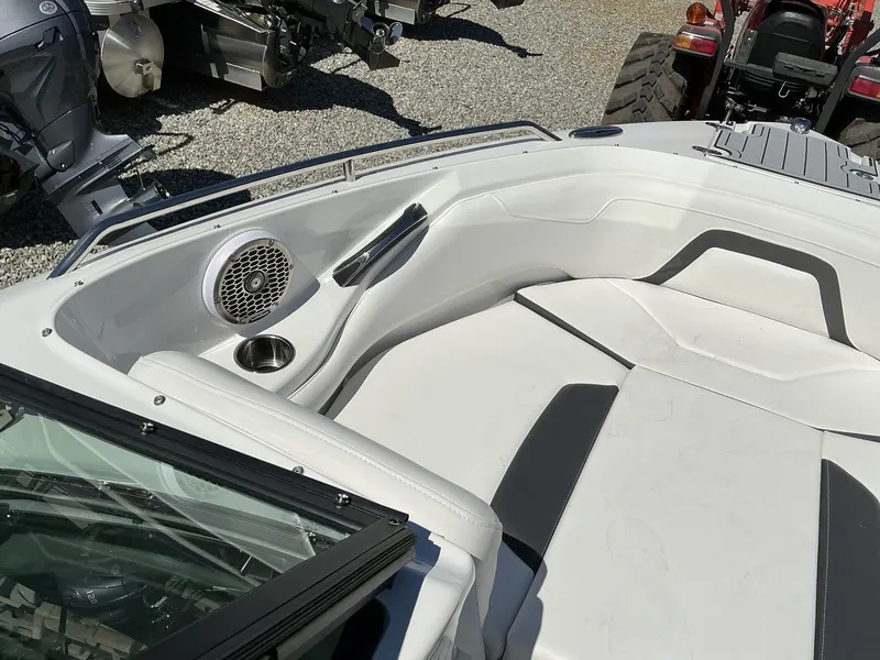 Slide: The Image of The image shows the bow area of a 2025 Monterey 224FS boat with white upholstery and speakers. - 9