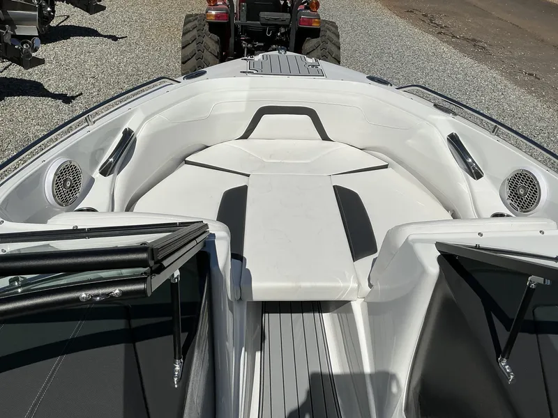 Slide: The Image of The image shows the bow area of a 2025 Monterey 224FS boat with white upholstery. - 15