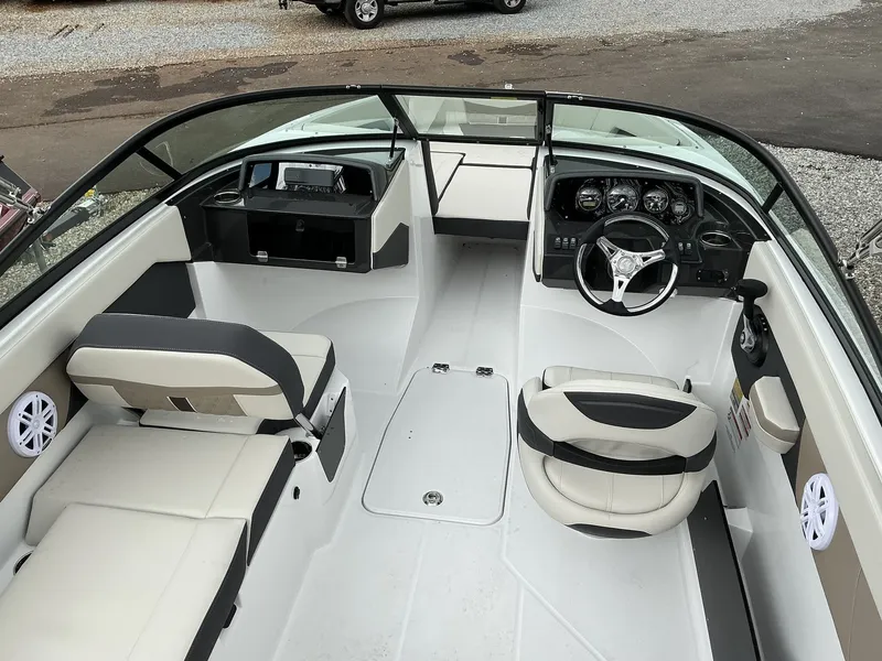 Slide: The Image of The image shows the cockpit of a 2025 Monterey M-205 boat with modern seating and controls. - 10