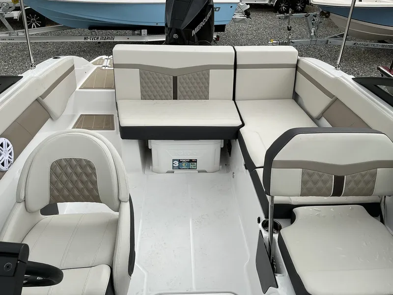 Slide: The Image of The image shows the cockpit of a 2025 Monterey M-205 boat with beige upholstery. - 6
